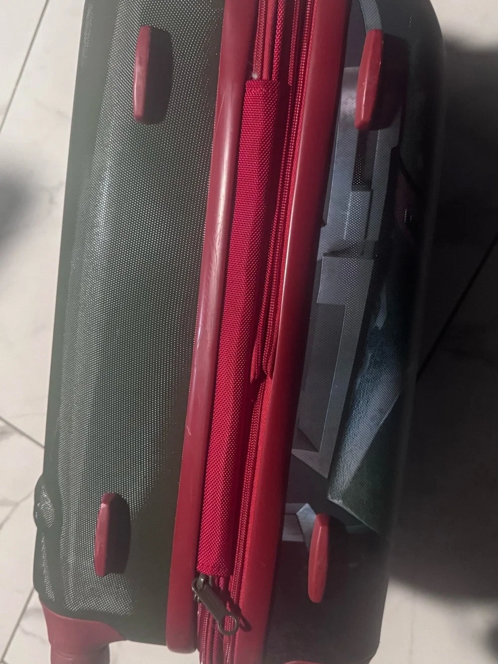 Green Hardshell Carry-On with red Accents